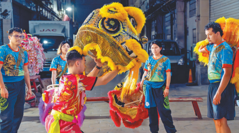 Peruvian young man into Chinese lion dance